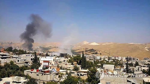 시리아 정부군의 포격을 받은 다마스쿠스의 한 지역(AP/아빈 유나이티드 미디어 오피스=연합뉴스DB)
